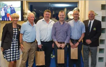  ??  ?? Philip Bonus, Raymond McElhinney, Conor Whelan, and Joe Hughes, third place winners at the 40th Anniversar­y of Founders Day in Blainroe Golf Club receive their prizes from Lady Captain Tina Meehan and Captain Peter Burgess.