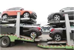  ?? — Reuters ?? Cars made by GM Korea are seen on trucks in a yard of GM Korea’s Bupyeong plant in Incheon, west of Seoul.