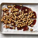  ?? FOOD STYLED BY SIMON ANDREWS. PHOTO BY ARMANDO RAFAEL/THE NEW YORK TIMES ?? Hazelnuts are coated in a homemade caramel before being blended in a food processor to create a praline paste for a Paris-Brest recipe.