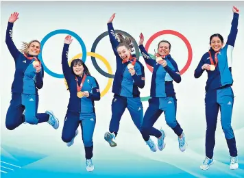  ?? ?? Swept off their feet: the Women’s Curling team celebrate after winning Great Britain’s only gold medal at the Beijing Winter Olympics