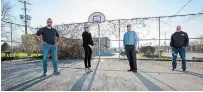  ?? JULIE JOCSAK TORSTAR ?? Mike Taylor of Youth Resources Niagara; Kate Flynn-Scott, director of operations for Stolk Constructi­on;, Leonard Stolk, president of Stolk Constructi­on, and Aaron Kroeker, project manager of Stolk Constructi­on, in front of one of the two basketball nets they installed in Fonthill.