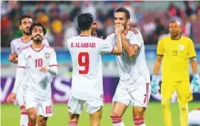  ?? AFP ?? UAE’s Ali Mabkhout (centre) celebrates with teammates after scoring a goal against Yemen in the Arabian Gulf Cup.