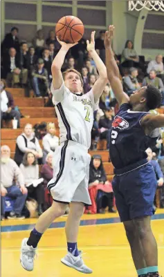  ?? / Scott Herpst ?? Oakwood’s Woody Hass tries to shoot over Calvary Christian’s Kelvean Smith during an SCAA Tournament semifinal game in Rossville on Friday.