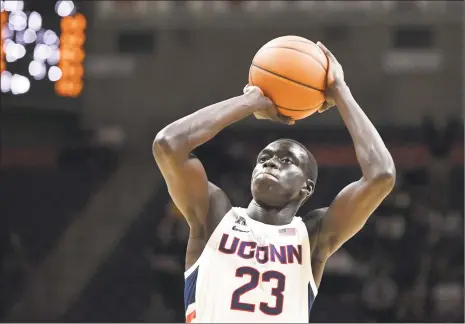  ?? Jessica Hill / Associated Press ?? UConn’s Akok Akok has remained positive while working through what he calls a “boring” rehab regimen.