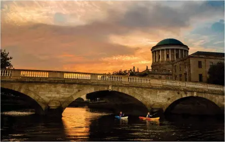  ?? ?? Pictured left: Kayaking on the River Liffey
Pictured opposite page clockwise from left: The Merrion; The Westbury; The Fitzwillia­m; The Merrion; Glover's Alley; Chapter One by Mickael Viljanen; Restaurant Patrick Guilbaud
