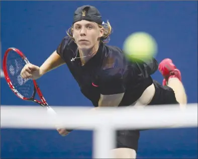  ?? The Associated Press ?? Denis Shapovalov, of Canada, serves to Kyle Edmund, of Great Britain, during their third-round match at the U.S. Open in New York on Friday. Shapovalov won when Edmund retired in the fourth set with a medical injury.