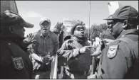  ?? AP ?? People protest Saturday in Pretoria, South Africa, against Zimbabwean first lady Grace Mugabe.