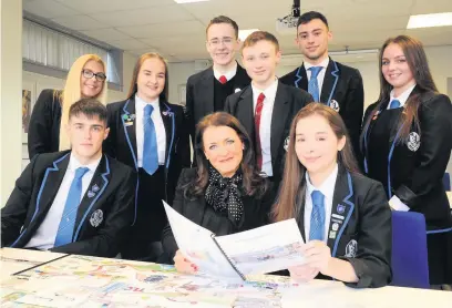  ??  ?? Top of the class Castlemilk High School head teacher Lynn McPhillips with senior pupils