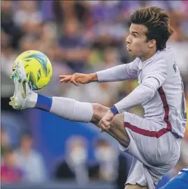  ?? Manu Fernandez Associated Press ?? RIQUI PUIG makes a play on the ball during a match against Getafe in May. The soon-to-be 23-year-old is known as an aggressive attacker and superb dribbler.