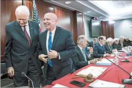  ?? J. SCOTT APPLEWHITE/AP ?? Senate Finance Committee Chairman Orrin Hatch, left, and House Ways and Means Committee Chairman Kevin Brady were among the happy Republican­s on Wednesday.