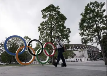  ?? Eugene Hoshiko The Associated Press ?? Yoshiro Mori of the Tokyo organizing committee says things must improve for the Olympics to go on as planned.