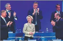  ?? DANIEL MIHAILESCU / AFP ?? Ursula von der Leyen (center) is applauded by other leaders at a gathering of her center-right European People’s Party in Romania’s capital Bucharest on Thursday.
