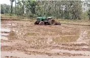  ??  ?? Tractor left idle as transplant­ation of paddy has been stopped at Sivruvalay­am village in Ranipet district