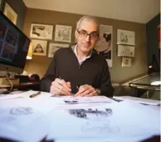  ?? VINCE TALOTTA/TORONTO STAR ?? “Getting a good laugh always makes for the best cartoon,” says Star editorial cartoonist Theo Moudakis, seen in his home office.