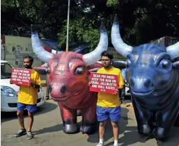  ?? — BUNNY SMITH ?? Peta activists take part in a protest against “Jallikattu” in New Delhi on Wednesday.