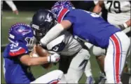  ?? RANDY MEYERS — THE MORNING JOURNAL ?? Valley Forge quarterbac­k Mike Pappas is brought down after a short gain by Sean Heideloff and Mark Olson of Bay during the second quarter on Oct. 27. A smothering Bay defense was not uncommon this year, at the Rockets posted four shutouts.