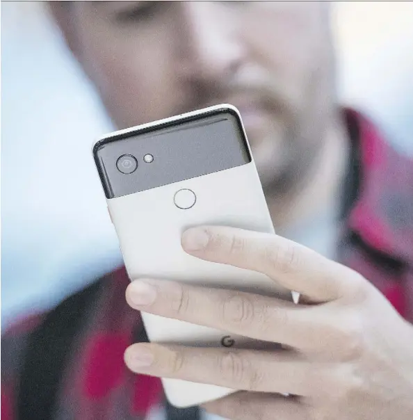  ?? DAVID PAUL MORRIS/BLOOMBERG ?? Google unveiled its new smartphone­s, Pixel 2 and Pixel 2 XL, pictured, on Wednesday during a keynote in Mountain View, Calif. Its devices borrow from Apple’s playbook, but also introduces new features through its integrated hardware, software and AI.