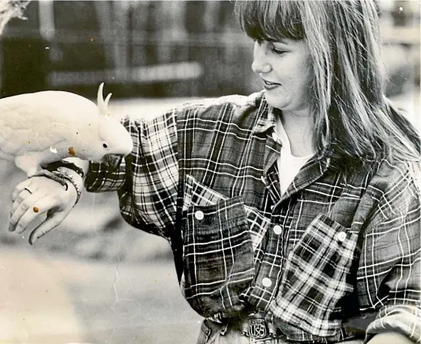  ?? ANTHONY MORAN/ NEWS LIMITED ?? Two of Kirsty Cameron’s looks inspired by Margaret Urlich: Checked shirt and chunky belt in 1989, left, and, below, a short haircut and rejection of the ‘‘Sydney permanent summer’’ look in 1990.