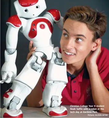  ?? Picture: ALISON WYND ?? Christian College Year 9 student Noah Saffin with a robot at the tech day at Kardinia Park.