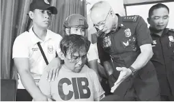  ??  ?? MURDER SUSPECT – Renato Llenes is presented to the media by PNP chief Oscar Albayalde at Camp Sergio Osmeña in Cebu City Thursday. (Juan Carlo de Vela)