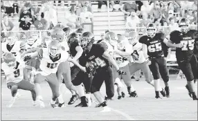  ?? MARK HUMPHREY ENTERPRISE-LEADER ?? Prairie Grove freshman Rhett Marrell (No. 24) broke off a 36-yard touchdown run during the junior Tigers’ 36-8 win over Farmington Thursday.