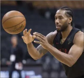  ?? FRANK GUNN - THE ASSOCIATED PRESS ?? Toronto Raptors’ Kawhi Leonard passes during practice for the NBA Finals in Toronto on Wednesday, May 29, 2019. Game 1of the NBA Finals between the Raptors and Golden State Warriors is Thursday in Toronto.