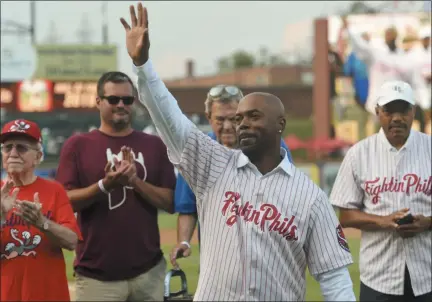  ?? BEN HASTY — MEDIANEWS GROUP ?? Jimmy Rollins waves to the crowd at Reading’s FirstEnerg­y Stadium Tuesday after his Hall of Fame Ceremony. Rollins, a Reading alum, was inducted into the Baseballto­wn Hall of Fame before the start of a Double-A game between the Fightin Phils and the Hartford Yard Goats