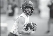  ?? NWA Democrat-Gazette/CHARLIE KAIJO ?? runs the ball Friday during the Southwest Elite 7on7 Showcase at Harmon Stadium in Fayettevil­le.