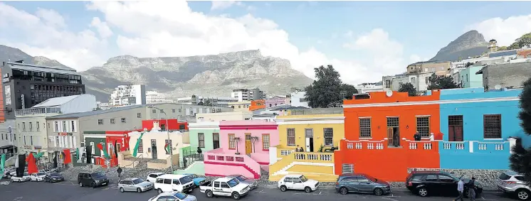  ?? Pictures: Esa Alexander ?? COLOUR CODED A row of houses in the Bo-Kaap. The houses, originally white, are said to have been painted in many colours by slaves celebratin­g being allowed to buy them.