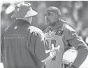  ?? TOM TINGLE/AZCENTRAL SPORTS ?? Cardinals coach Bruce Arians speaks with cornerback Patrick Peterson during practice at the team’s Tempe training facility on Wednesday.