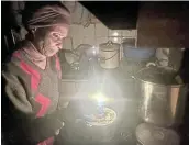  ?? ?? TAKING A DIM VIEW: Kuku Mashibini of Zone 3 in Ezibeleni outside Komani says they use candles as the municipali­ty has imposed electricit­y load reduction.