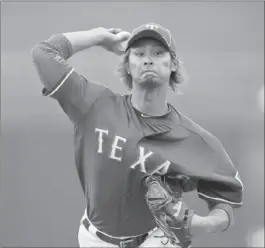  ?? Lenny Ignelzi Associated Press ?? THE ADDITION of pitcher Yu Darvish fills a void in the Rangers’ rotation left by C.J. Wilson and strengthen­s a team that has won back-to-back AL pennants.