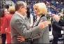  ?? Jessica Hill / Associated Press ?? Baylor coach Kim Mulkey and UConn coach Geno Auriemma greet each other before a January
2020 game. The teams’ matchup scheduled for Thursday has been canceled after Mulkey tested positive for
COVID-19.