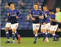  ?? Pictures: Charlotte Tattersall/getty Images ?? Harry Clarke, left, after scoring Oldham’s winner