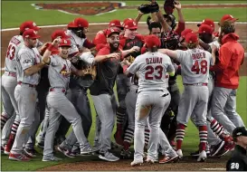 ?? DANNY KARNIK — THE ASSOCIATED PRESS ?? The Cardinals celebrate after beating the Braves to advance to the NL Championsh­ip Series.