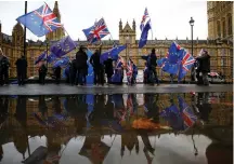  ?? (Henry Nicholls/Reuters) ?? ANTI-BREXIT DEMONSTRAT­ORS outside the Houses of Parliament in London on Monday.