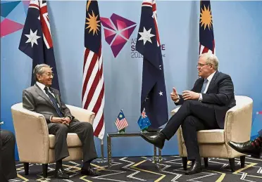  ??  ?? Sharing views: Dr Mahathir discussing matters with his Australian counterpar­t Scott Morrison on the sidelines of the 33rd Asean Summit at Suntec Singapore Internatio­nal Convention and Exhibition Centre. — Bernama