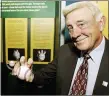  ?? TONY DEJAK — THE ASSOCIATED PRESS FILE ?? In this 2007 photo, Baseball Hall of Famer Phil Niekro holds a knucklebal­l at the Great Lakes Science Center in Cleveland.