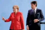  ?? AP ?? German Chancellor Angela Merkel, left, and the Prime Minister of Italy Giuseppe Conte, right, during talks in Berlin earlier this week.