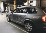  ?? Eric Risberg / Associated Press ?? An Uber driverless car is displayed in a garage in San Francisco.