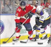  ?? JOEL AUERBACH / ASSOCIATED PRESS ?? Panthers defenseman Jason Demers and Blues right wing Scottie Upshall battle for the puck behind the net in Thursday night’s game.