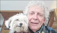  ??  ?? Dr. Walter Vanast, here with the pet dog he travels with, is from the Montreal area. He spends a week in southweste­rn Nova Scotia every two months.