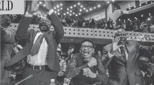  ?? JEKESAI NJIKIZANA / AFP / GETTY IMAGES ?? Zimbabwe’s members of parliament celebrate after Robert Mugabe’s resignatio­n letter had been read by the speaker of parliament on Tuesday. Mugabe, who once vowed to rule for life, has dominated every aspect of Zimbabwean public life since the country’s...