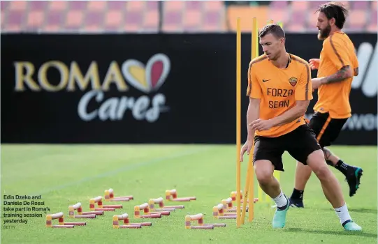  ?? GETTY ?? Edin Dzeko and Daniele De Rossi take part in Roma’s training session yesterday