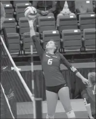  ?? The Sentinel-Record/Richard Rasmussen ?? WITHIN REACH: Henderson State setter Abby Blackburn reaches to return a shot by Southweste­rn Oklahoma State during the Reddies’ four-set victory in the semifinals of the GAC tournament Friday at Bank OZK Arena.