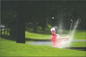  ?? Arkansas Democrat-Gazette/Stephen Swofford ?? CLEARING THE BEACH: Fayettevil­le’s Matthew Cole, who attends the University of Houston, hits his ball out of a sand trap on the 18th hole during the ASGA Men’s Amateur Championsh­ip at Hot Springs Country Club Saturday. Cole leads the pack by two strokes going into today’s final round.