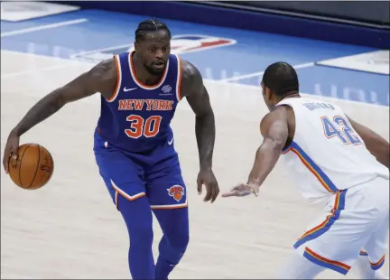  ?? GARETT FISBECK - FREELANCER, AP ?? New York Knicks forward Julius Randle (30) goes against Oklahoma City Thunder center Al Horford (42) during the second half of an NBA basketball game, Saturday, March 13, 2021, in Oklahoma City.