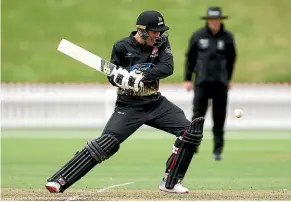  ?? GETTY IMAGES ?? Andrew Fletcher hits powerfully through the off side during his matchwinni­ng century for Wellington against Canterbury.