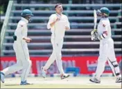  ?? AFP ?? Duanne Olivier’s (centre) five-for helped bowl out Pak for 185.