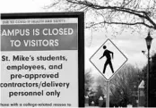  ?? LISA RATHKE/AP 2020 ?? A sign at the entrance to St. Michael’s College in Vermont says that the campus is closed to visitors due to an outbreak of COVID-19.